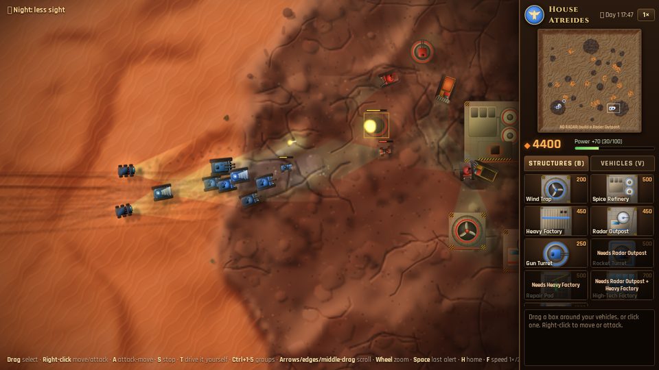 Tanks attacking an enemy base at dusk in the desert