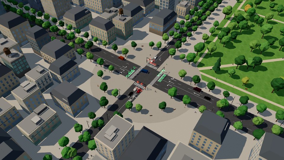 A city crossing with traffic lights, trees and a park, seen from above